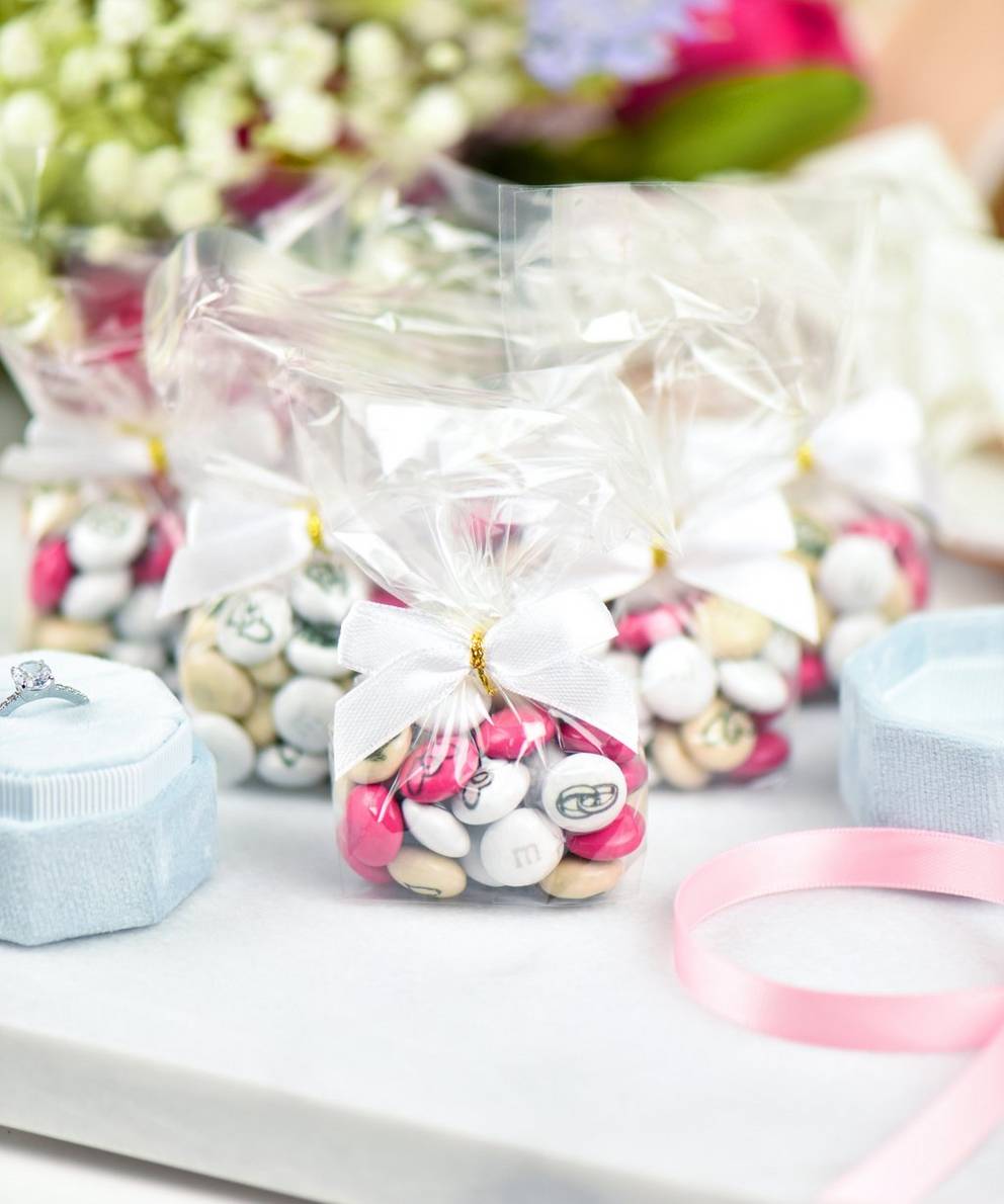 small bags filled with personalised M&M'S on table