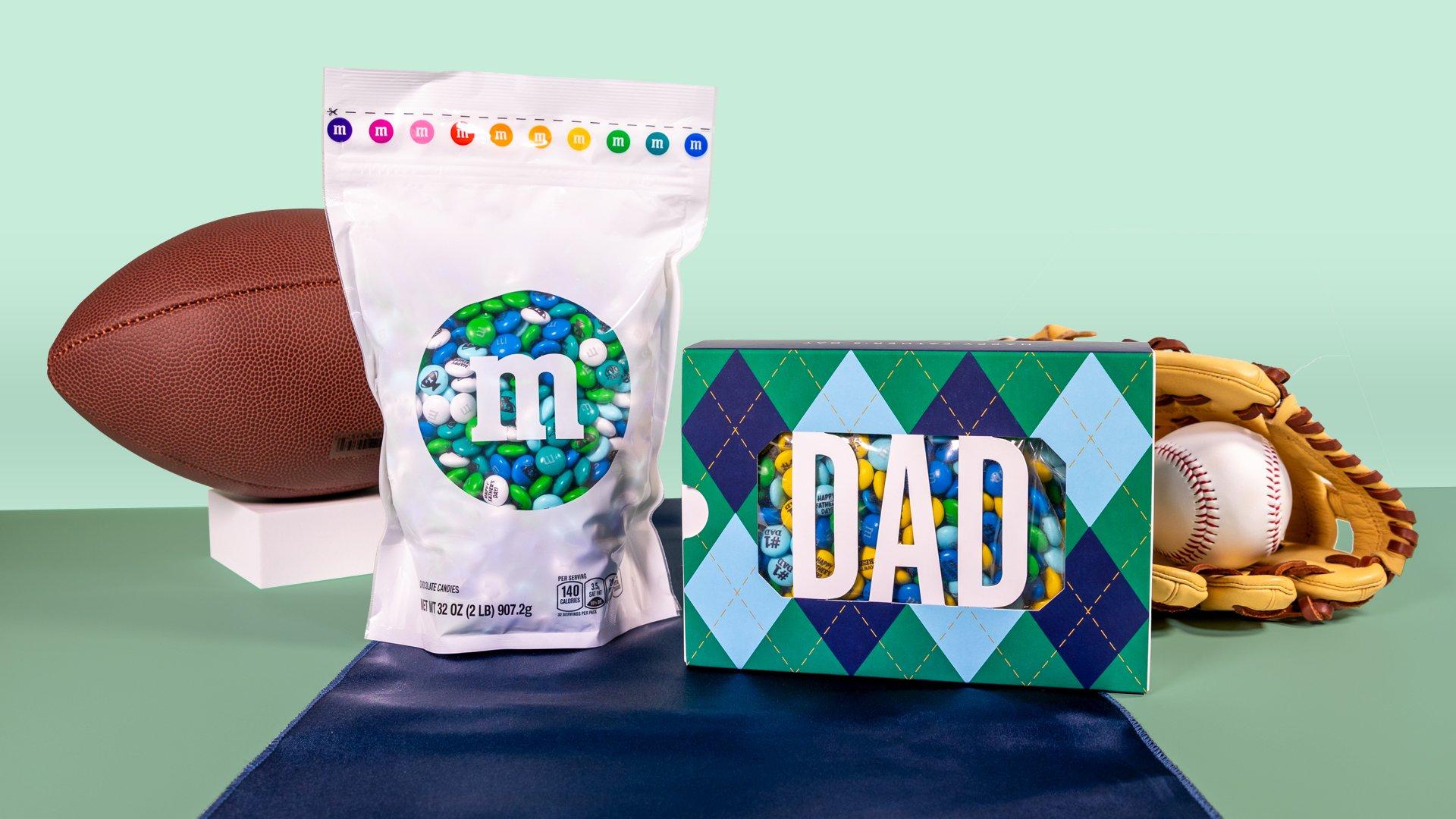 Bulk bag and gift box on table with football and baseball glove and ball