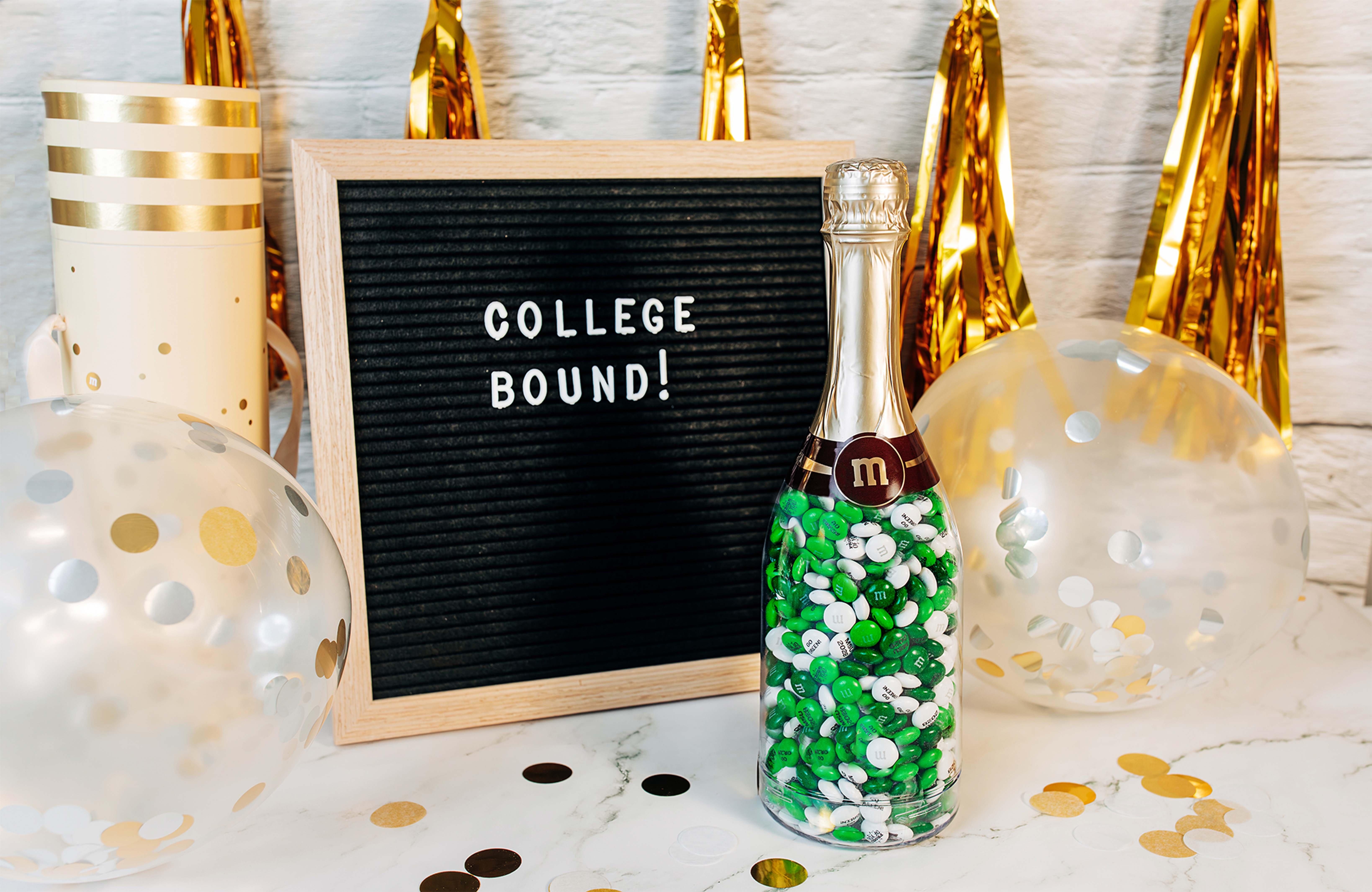 occasion bottle and letter board with decorations on table