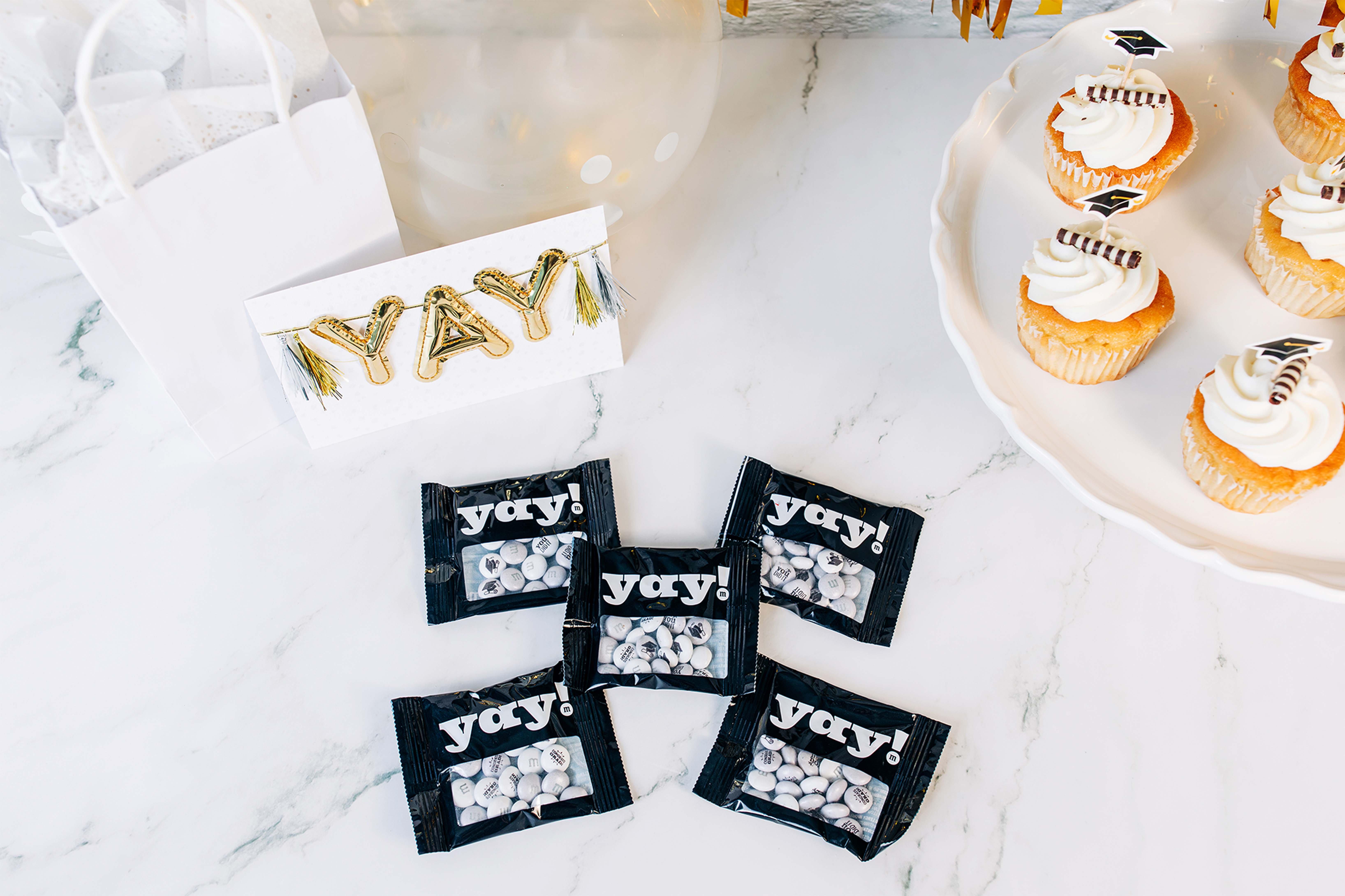 congrats grad party favors on table