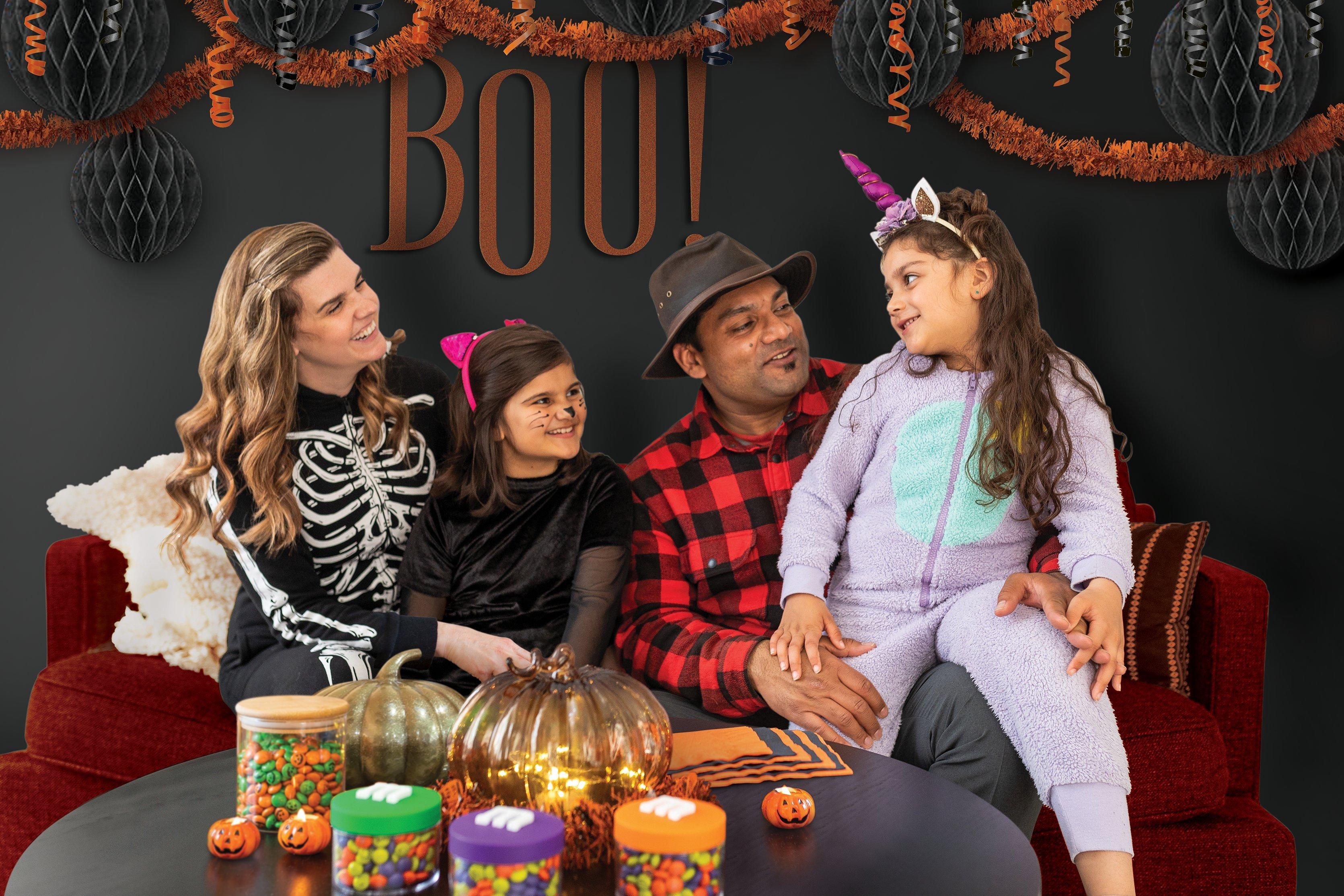 Family dressed up sitting on couch