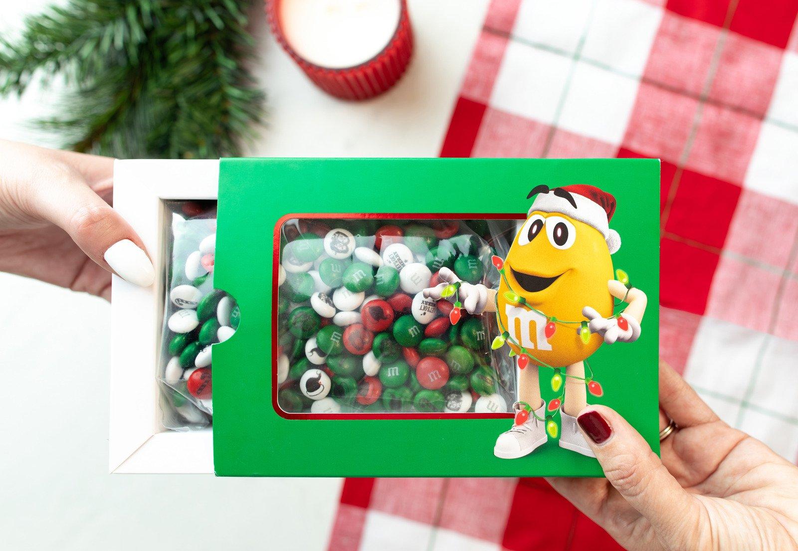 two people exchanging a Christmas Gift Box