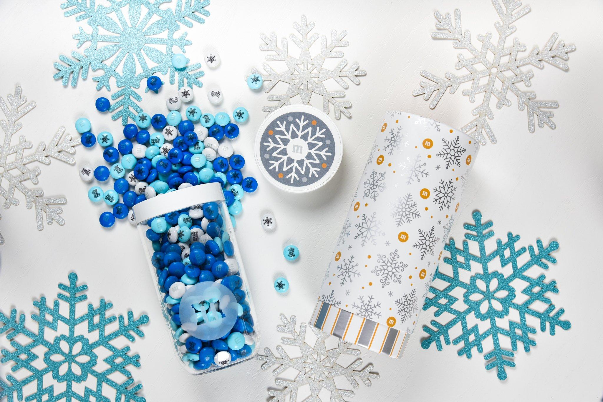 gift jar spilling out M&M'S with gift tube next to it