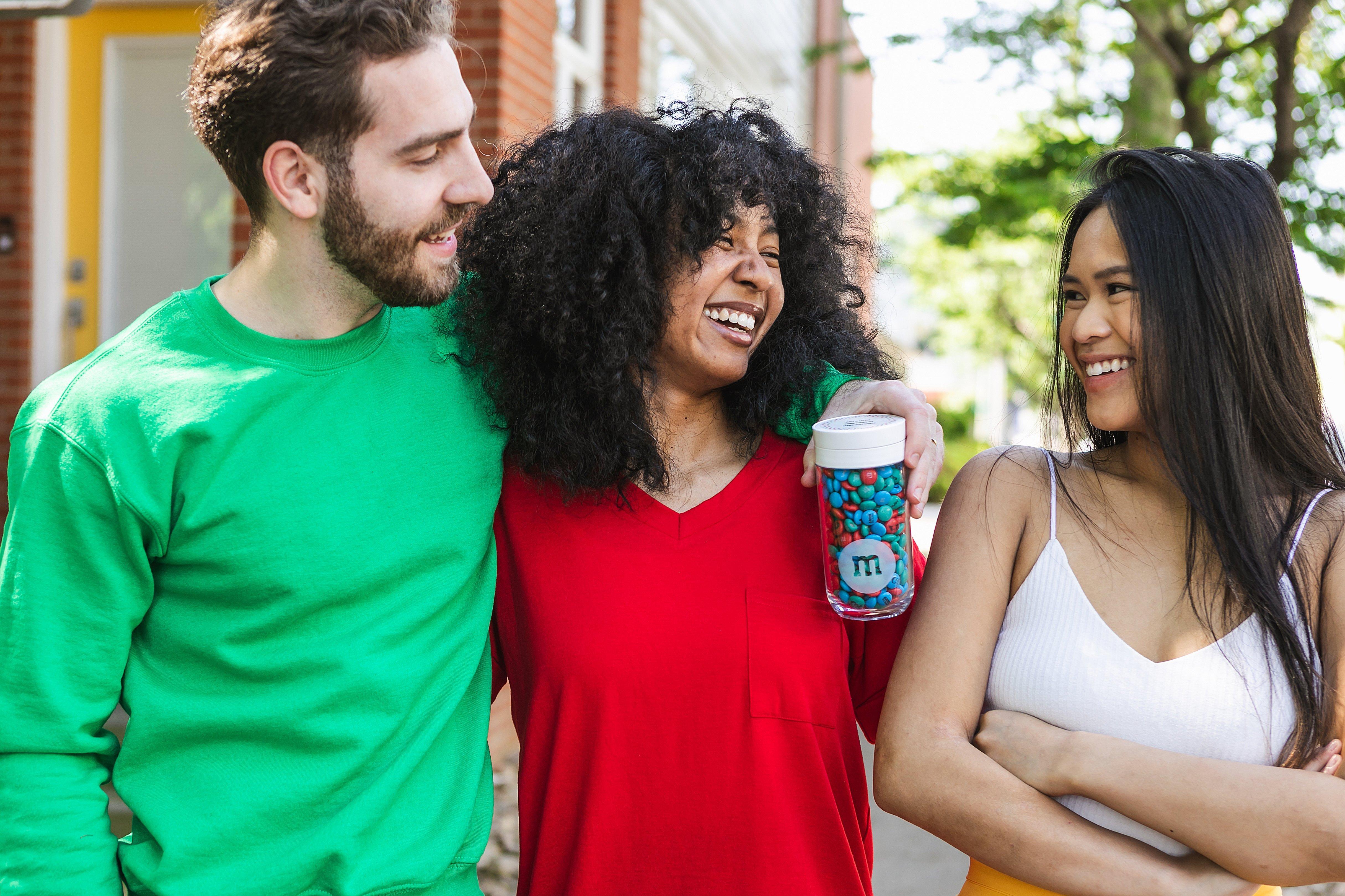 three friends having a good time laughing