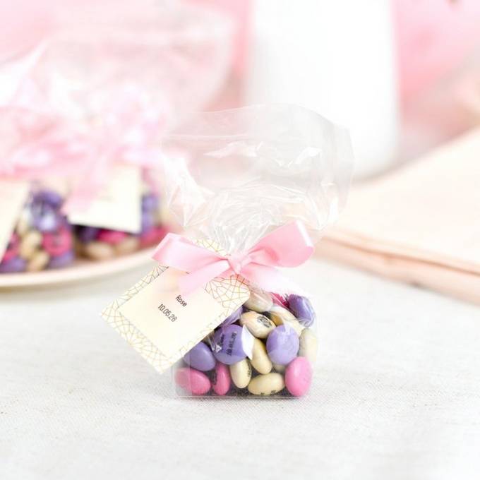 small bag with tag M&M's communion decoration