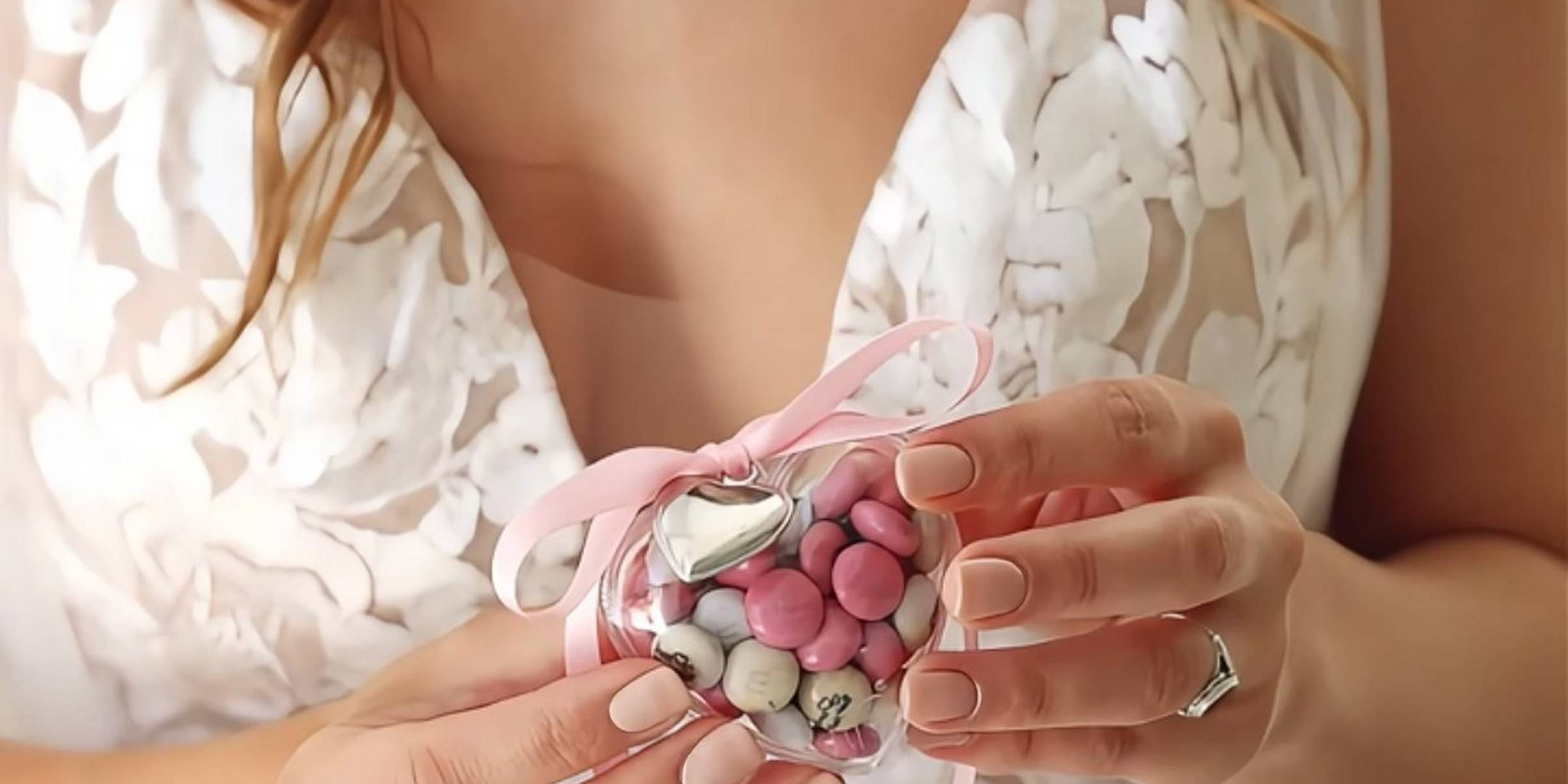 bride holding small heart filled with personalised M&M'S