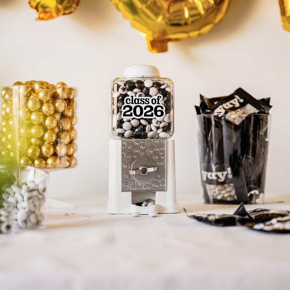 graduation gifts, party favors & desserts spread on a table