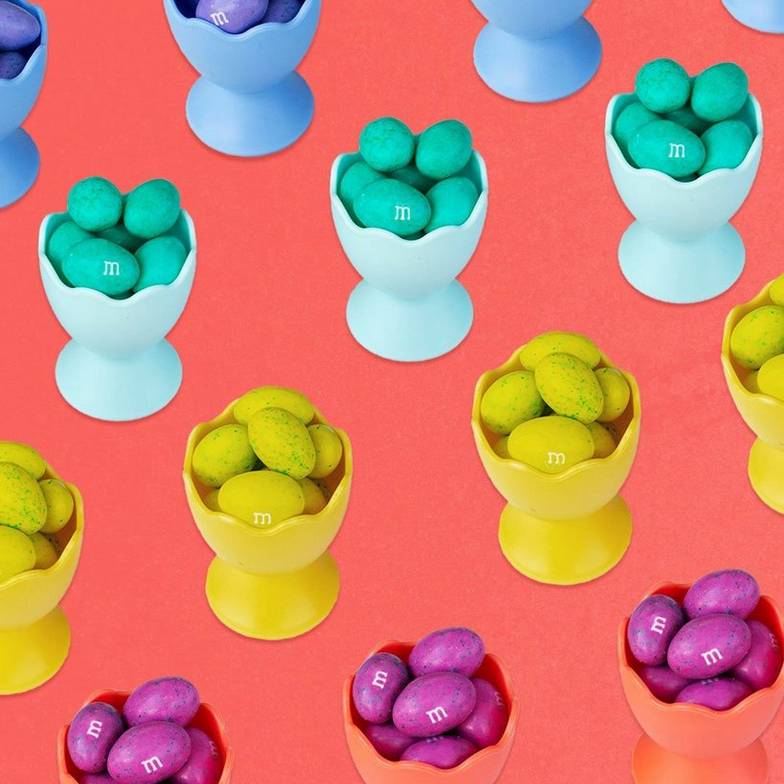 colorful peanut m&m's candy in little containers