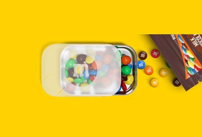 to go pack filled with milk chocolate M&M'S and opened along with a milk chocolate bag