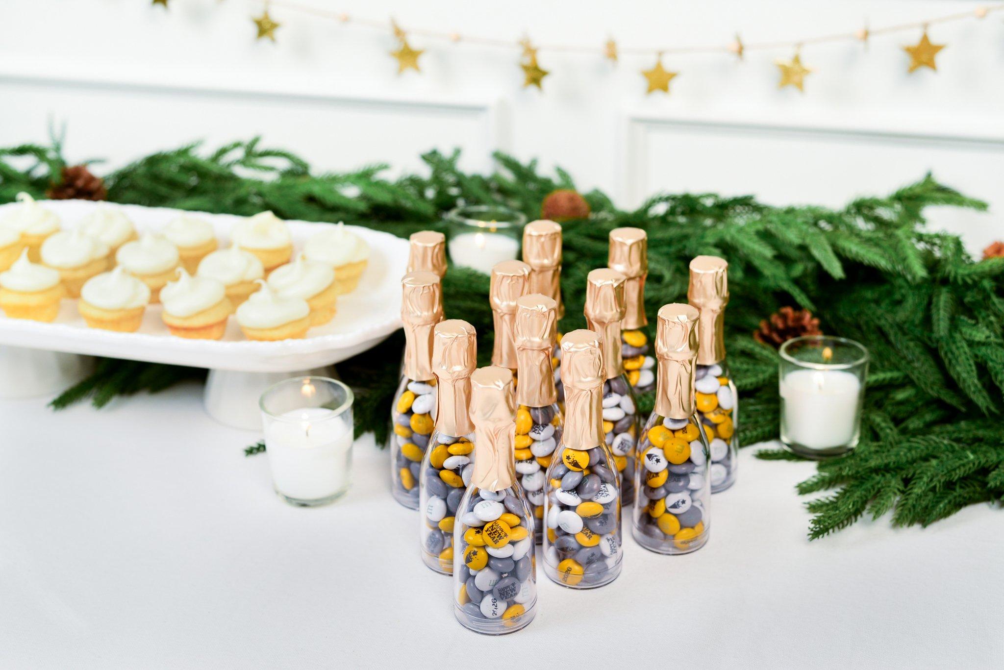 mini occasion bottles on a dessert table