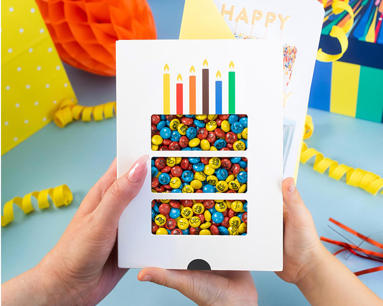 personalised gift box filled with purple, yellow and white M&M’S