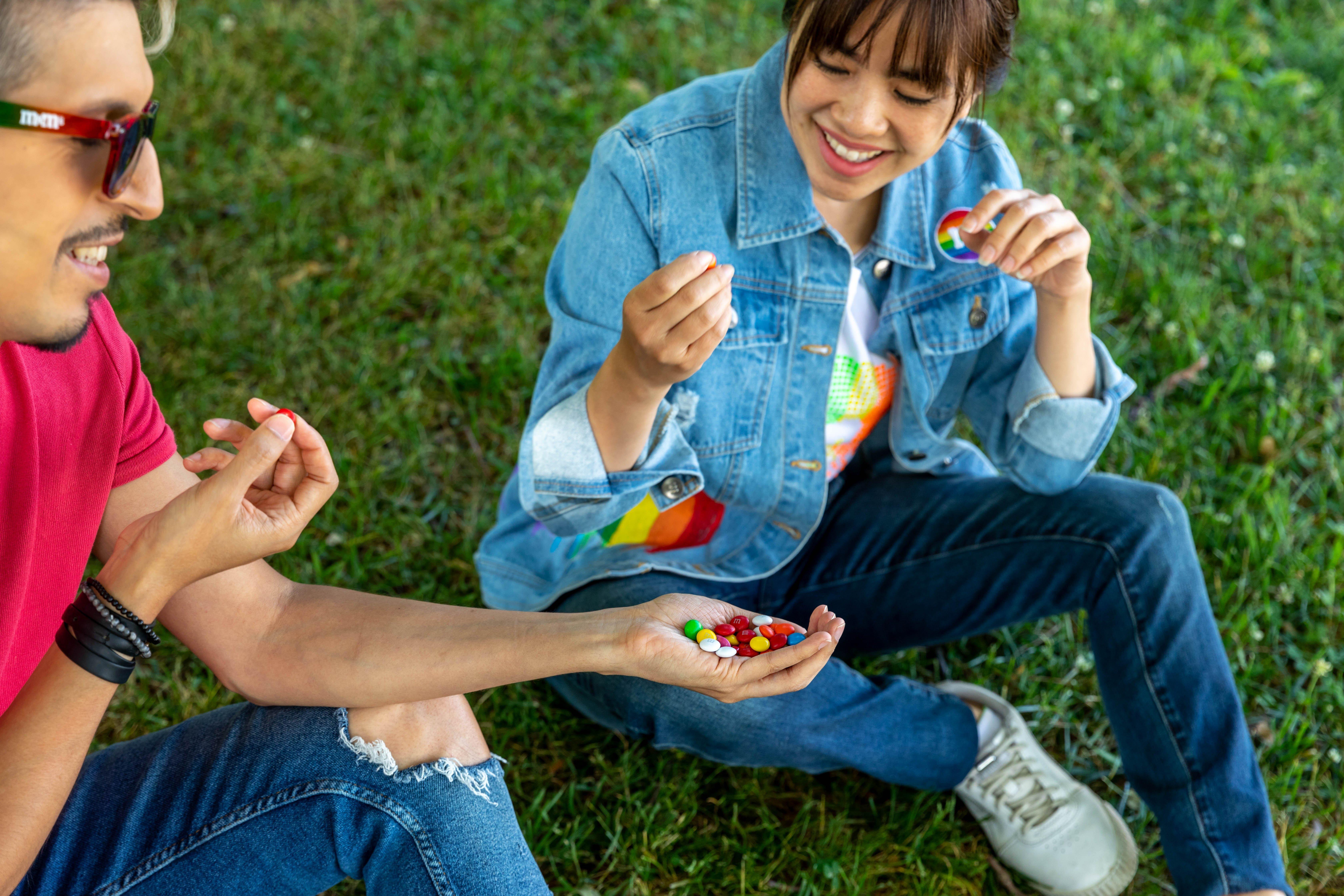 Two friends sharing M&M'S