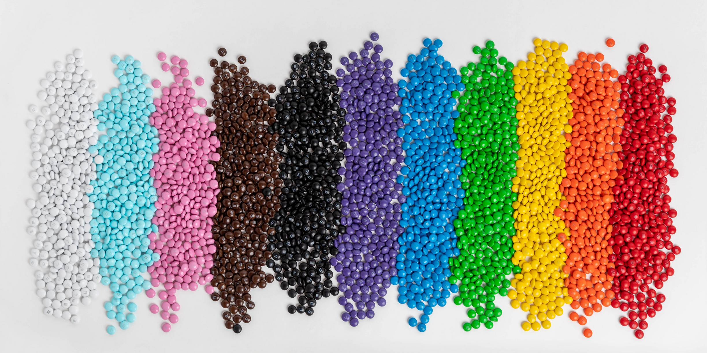 M&M'S containers in the color of the rainbow
