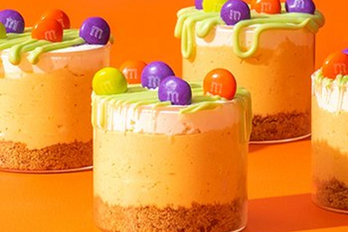 Pumpkin cheesecake cups on table