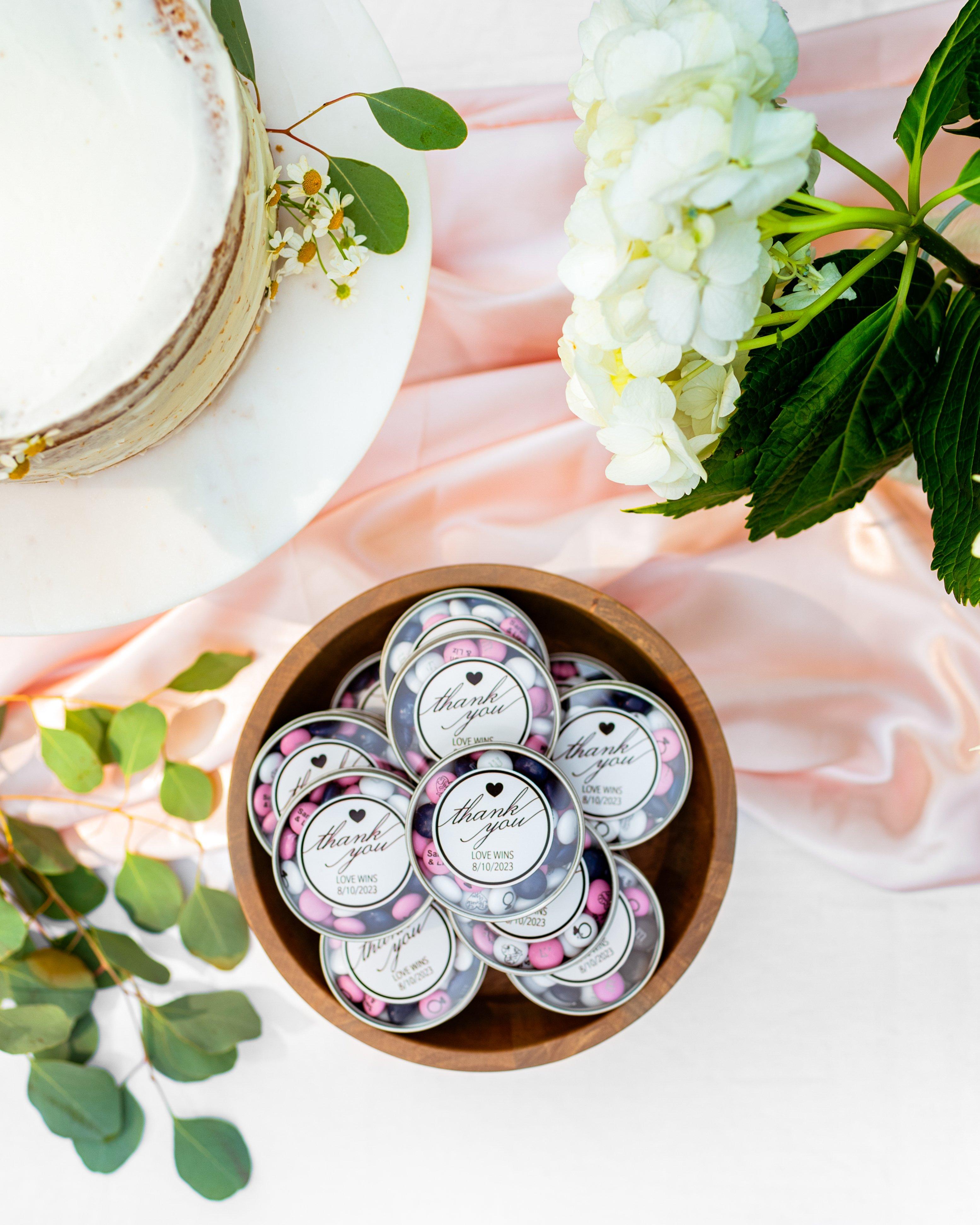 wedding favor display featuring customized M&M'S favor tins