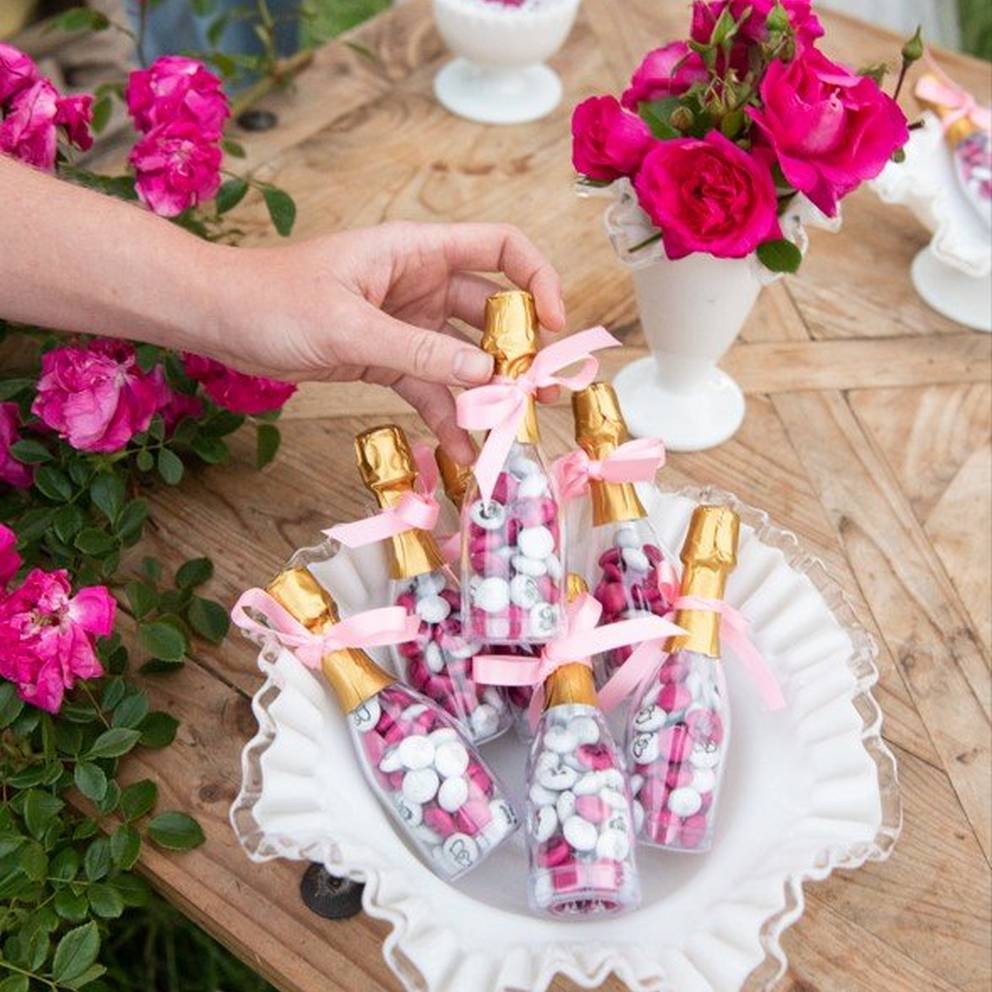 mini gift bottles filled with pink and white M&M’S