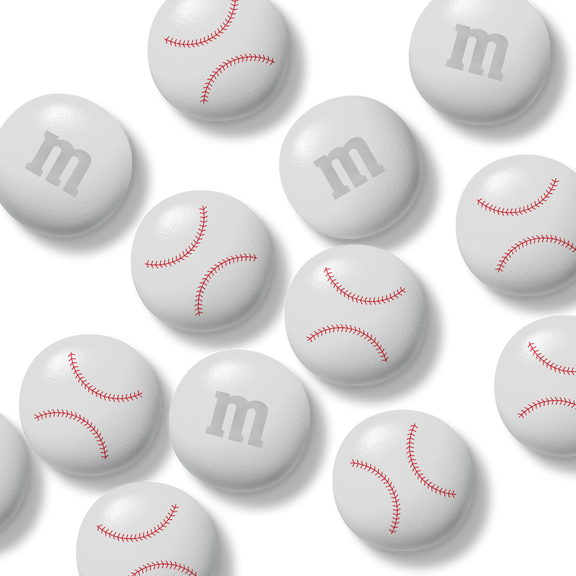 Bag of M&M'S chocolate candies, 32 oz, with Gemini zodiac symbol in packaging window, held in hand.