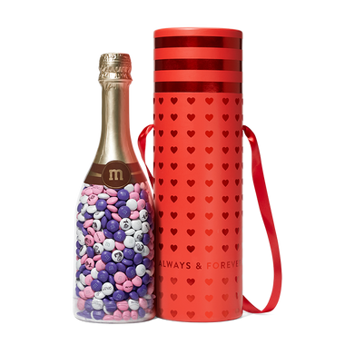 red always & forever gift tube next to a gift bottle filled with personalized M&M'S