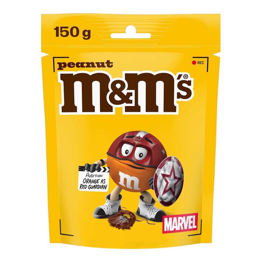 Bag of M&M'S peanut chocolate candies, 150g, featuring Red dressed as a Marvel character holding a shield and clapperboard reading "Audition: ORANGE AS RED GUARDIAN."