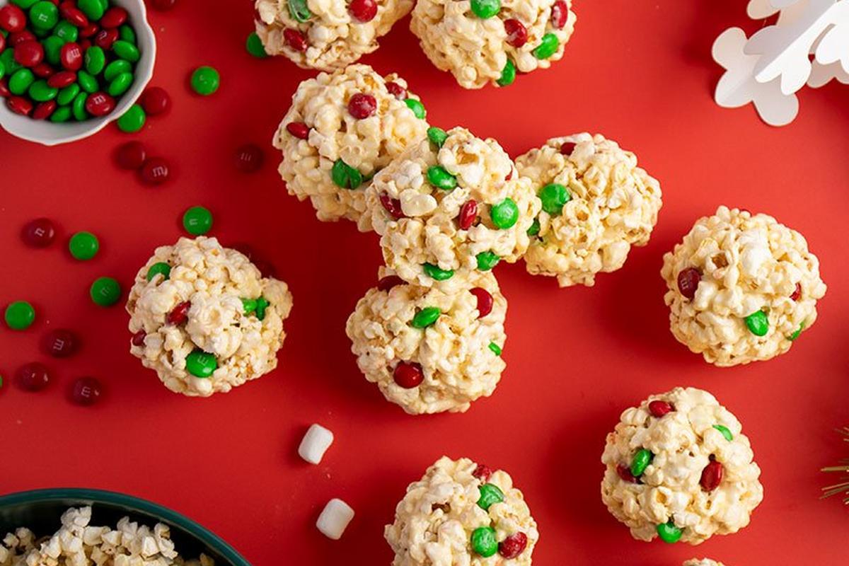 holiday popcorn balls on table with green & red M&M'S