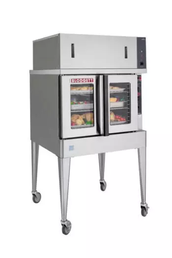 Blodgett commercial oven with double glass doors, showing trays of food inside, on wheeled stand.