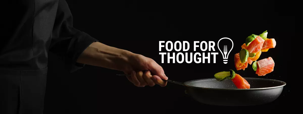 Chef tossing salmon and vegetables in a frying pan beside the text “FOOD FOR THOUGHT”.