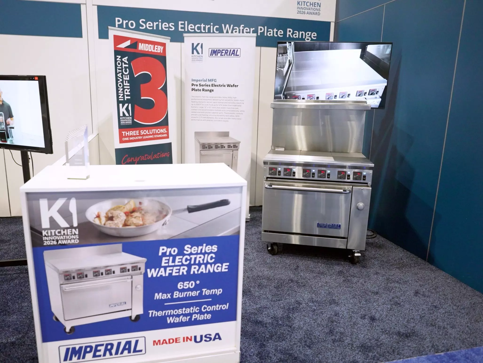 Imperial Pro Series electric wafer plate range display with stainless unit and signage.