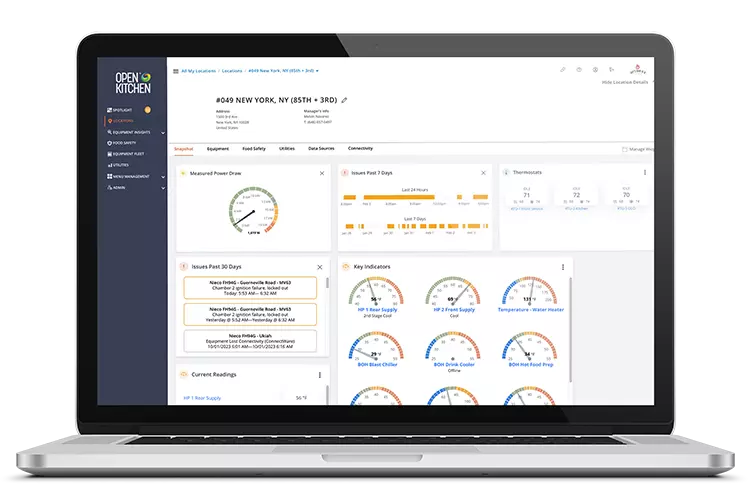 Laptop displaying Open Kitchen software with various data dashboards and indicators.