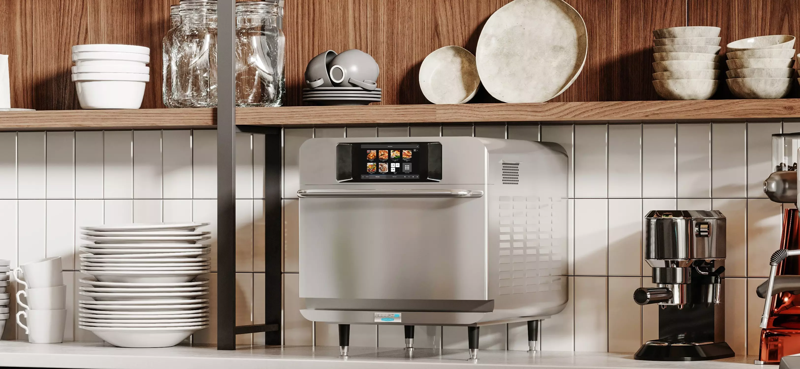 Countertop commercial oven with touchscreen beside an espresso machine and stacked dishes.