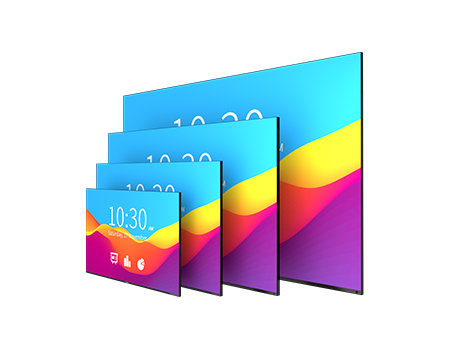 a group of four large monitors are displayed on a table