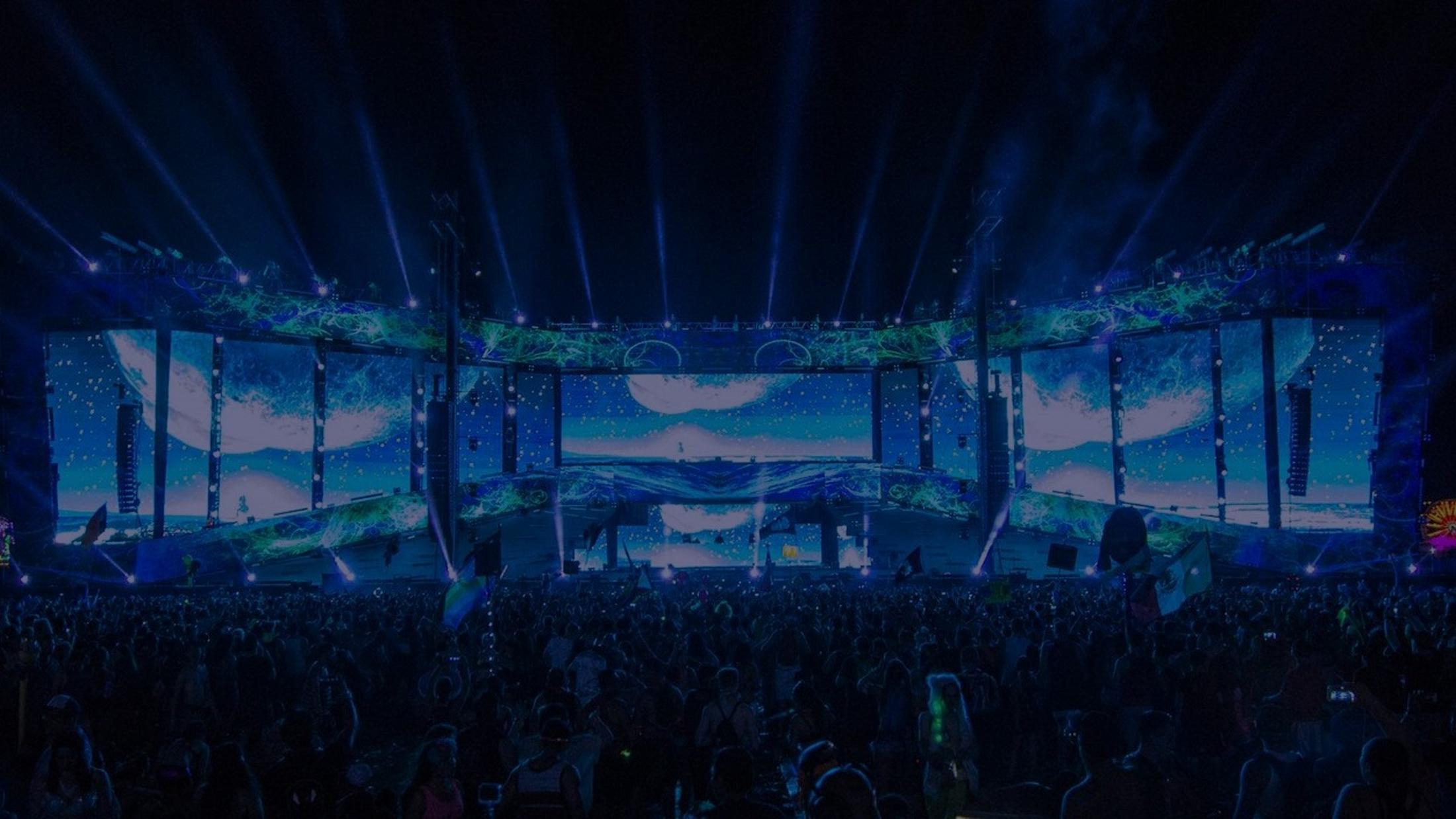 a large stage with a large screen and lights