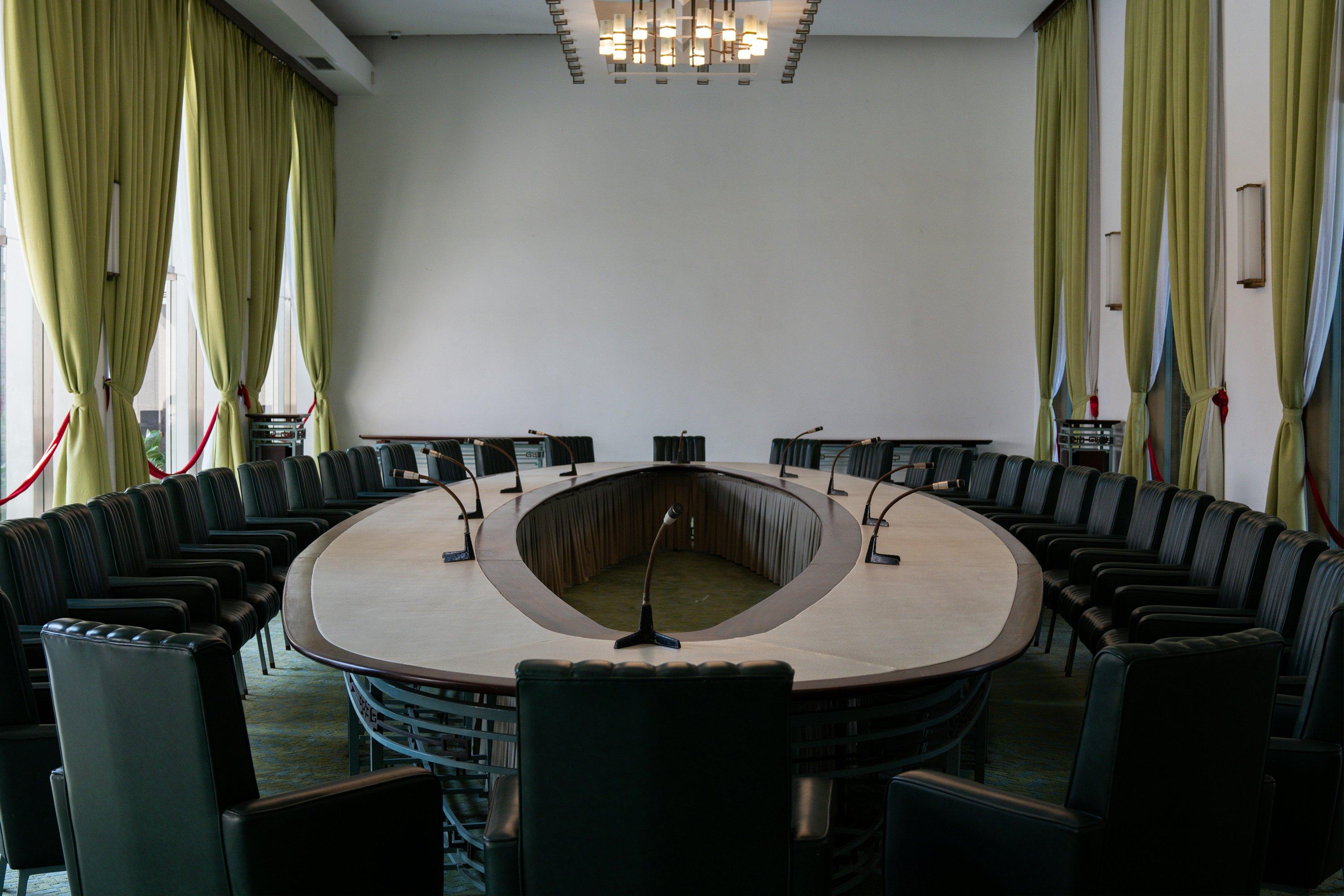 a large conference room with a long table and chairs