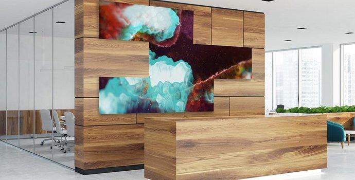 a modern office with a large wooden wall and a large painting