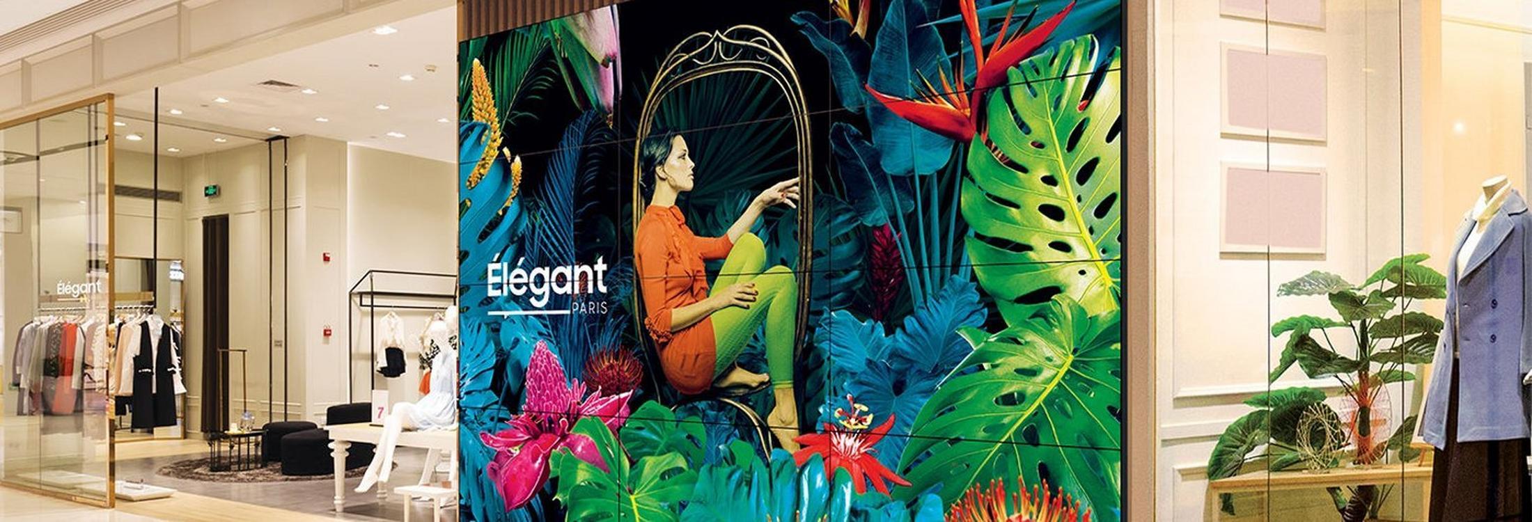 a large mural on the wall of a clothing store