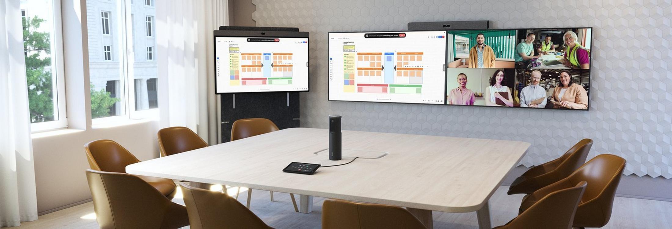 a large room with a table and chairs and a tv on the wall