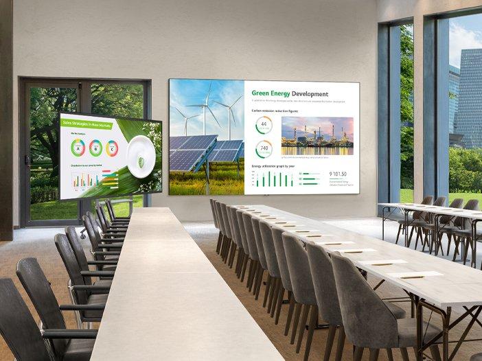 a large conference room with a large screen showing a city