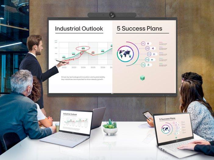 a group of people sitting around a table in a conference room