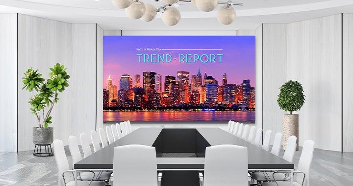 a large conference room with a large screen and a white table