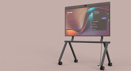 a large screen on a stand with wheels on it