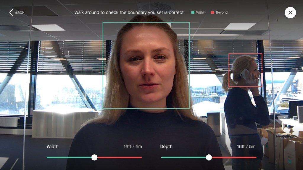 a woman with a face scan on a computer screen