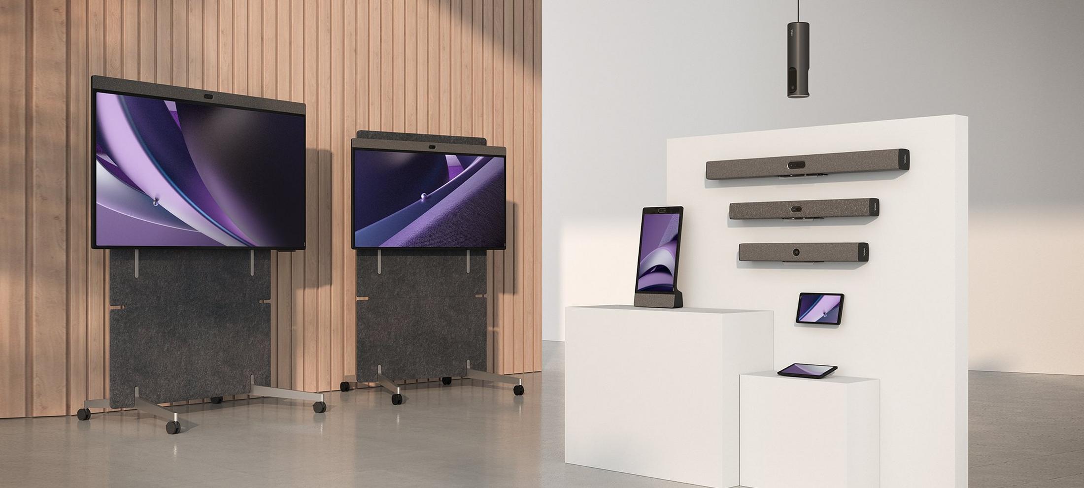 a room with a large screen and a tablet on a stand