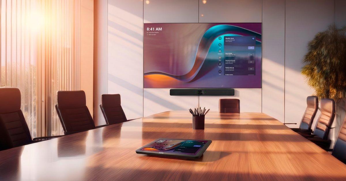 a large screen is mounted on the wall in a conference room