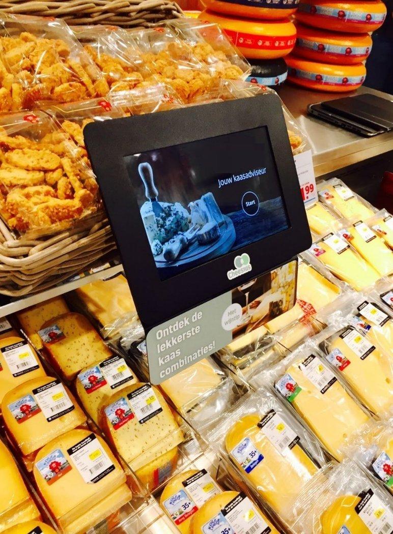 a display of a display of cheese and other food items