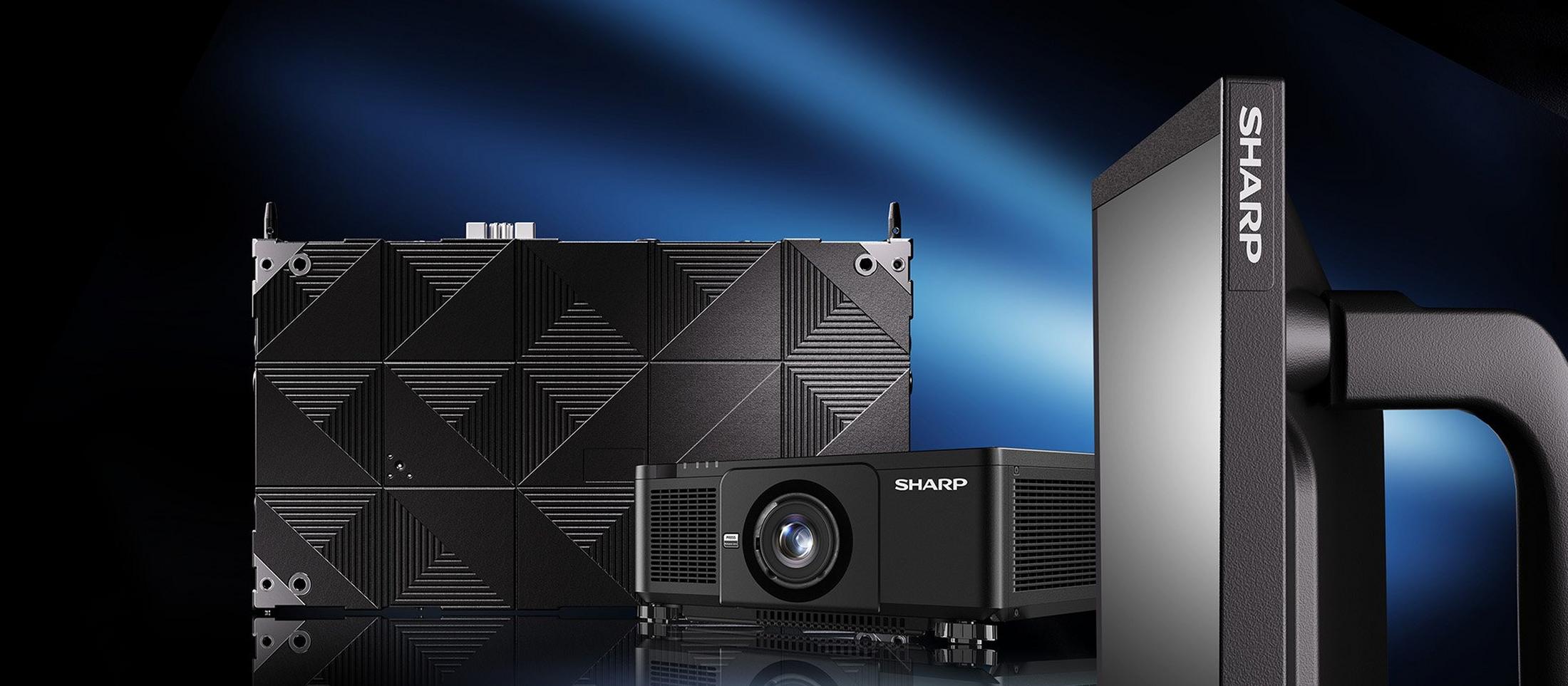 a large projector and monitor sitting on a table next to each other