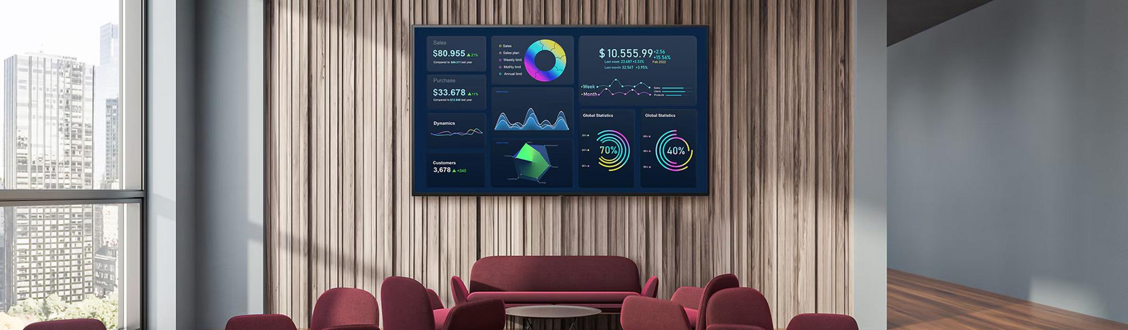 a large room with a large screen and a bunch of chairs