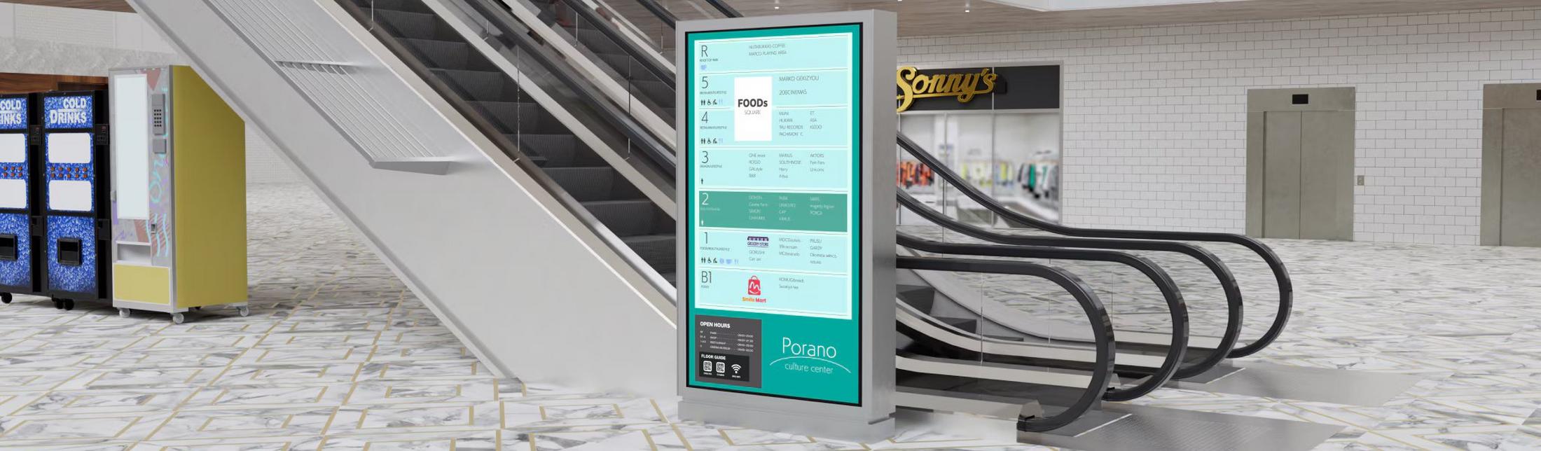 a computer screen is displayed on the escalator in a mall