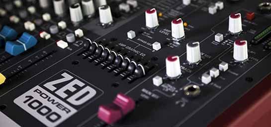 a close up of a mixer with many knobs and buttons