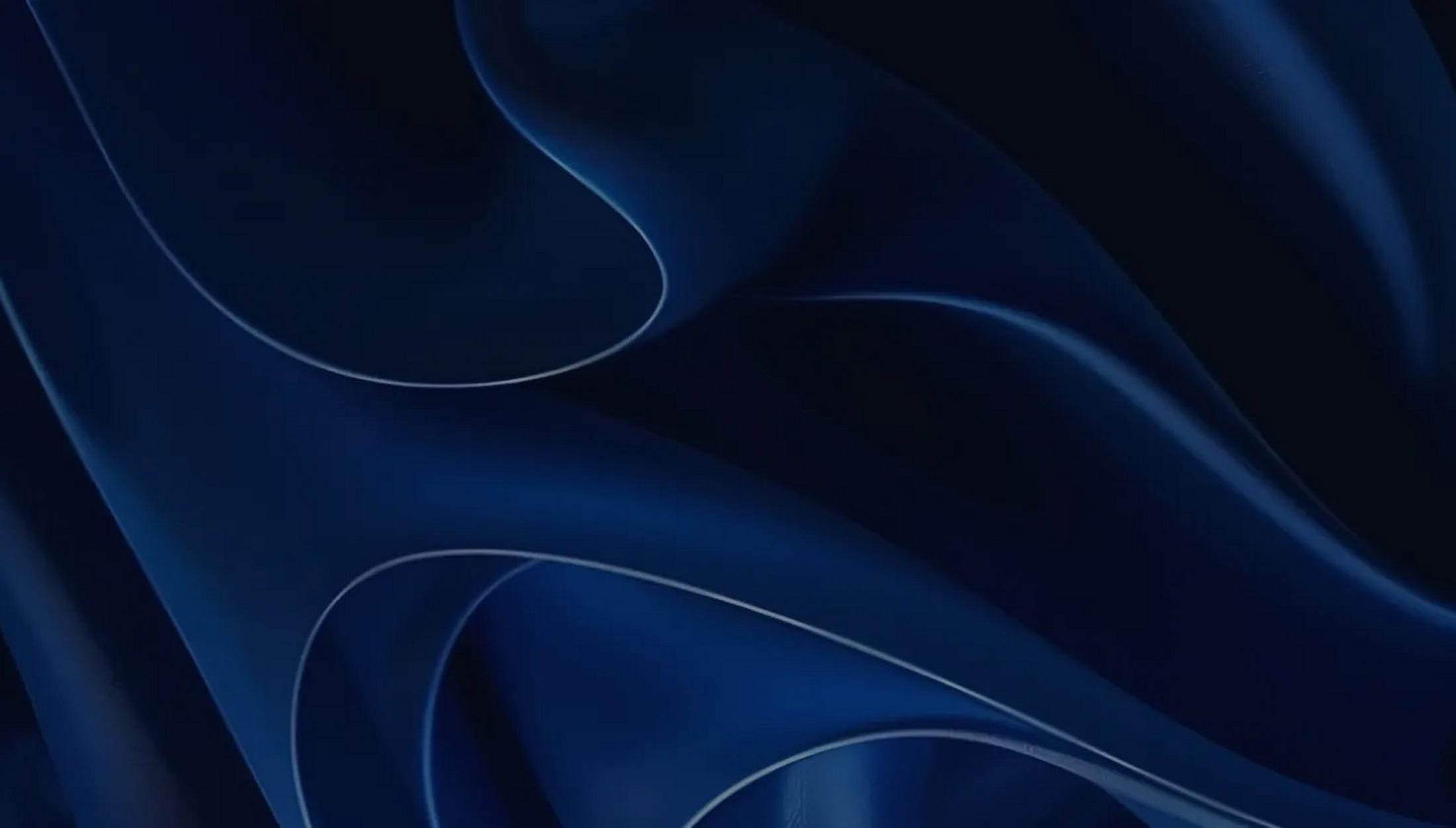 a close up of a blue fabric with wavy lines