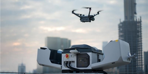 a woman wearing headphones and a headset is looking at a stage a woman wearing headphones and a headset is looking at a stage