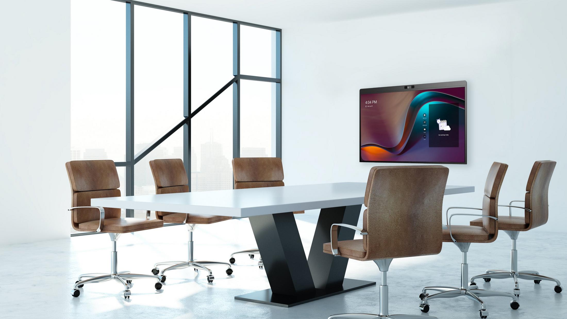 a conference room with a table and chairs and a tv